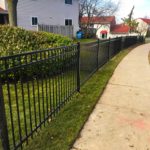 black steel fence install