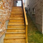 side access wood stairs with railing