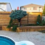 wood pool fence and retaining wall